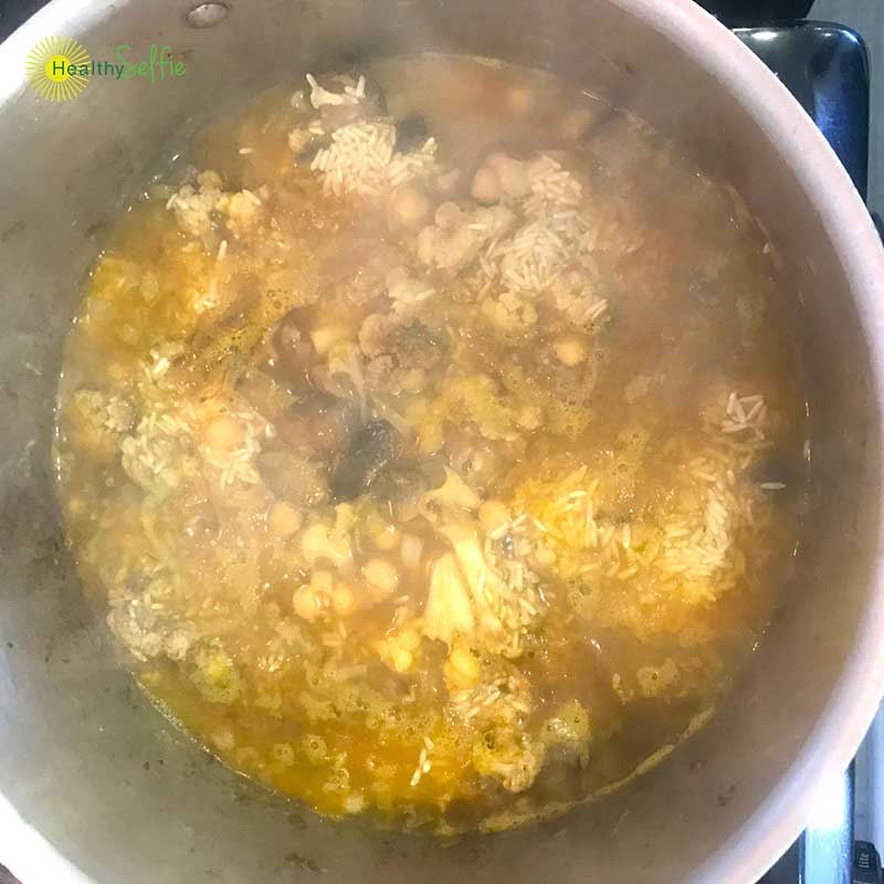 Boiling The Brown Rice, Chickpeas, and chopped vegetables.